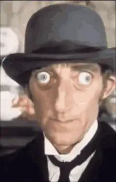 Man in bowler hat with bulging eyes