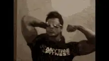 Man flexing then falling over
