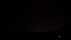 Massive lightning strike illuminates night sky