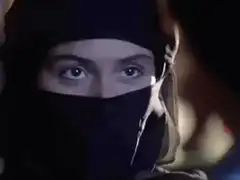 Woman in black niqab staring