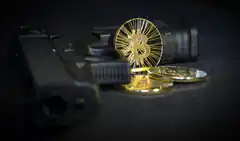 gun and bitcoin coins