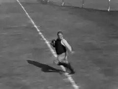 vintage football player running with ball