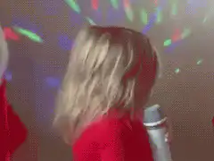 Confident toddler singing with microphone