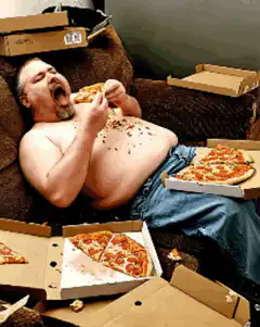Man eating pizza on couch