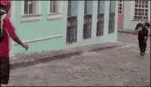 Man dodges football players