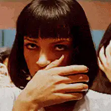 Uma Thurman as Mia Wallace looking at camera