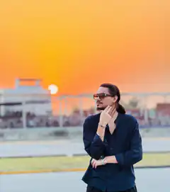 Man in sunglasses at sunset