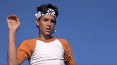 Elvis Presley raising hand
