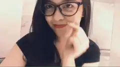 Woman winking and touching nose