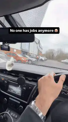 Driving past rows of unsold cars