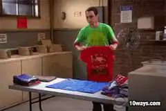 Sheldon folds a t-shirt perfectly