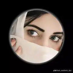 Woman peeking through veil in circle