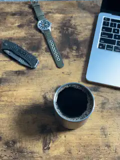 Coffee cup on wooden desk