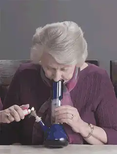 Old lady smoking a bong