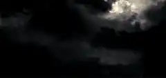 Dark storm clouds and lightning flashes