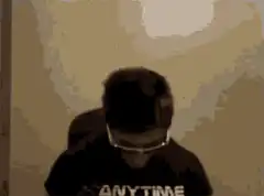 Man in Anytime Fitness shirt flexing