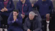Mourinho and assistant celebrate on sidelines