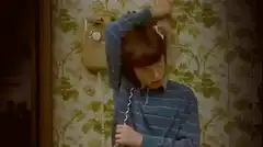 Boy with phone stuck to head