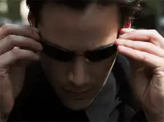 Neo puts on sunglasses