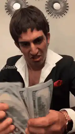 Man counting money and looking suspicious