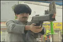 Man shooting a large gun