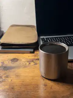 Coffee cup on wooden desk