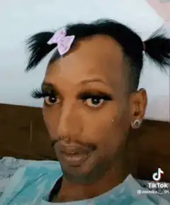 Person with pigtails and bow blinking