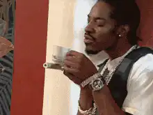 Snoop Dogg sipping tea and looking cool