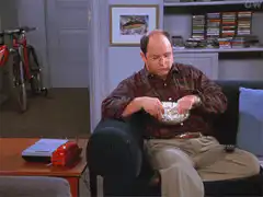 George Costanza eating popcorn