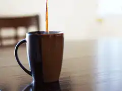 Coffee being poured into a mug