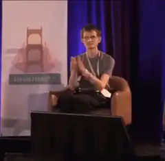 Guy clapping in chair