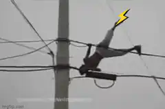 man hanging on power lines with lightning