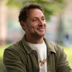 Man smiling outdoors