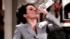 Woman chugging water from a bottle
