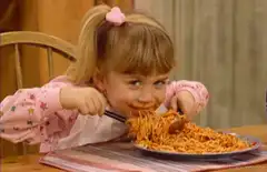 girl eating spaghetti messily