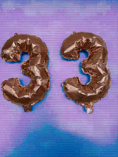 Two chocolate number 3 balloons