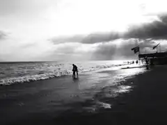 silhouette of couple on beach at sunset