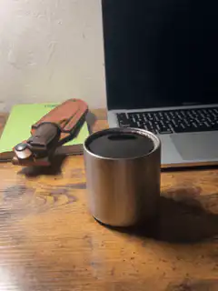 steam rising from metal cup