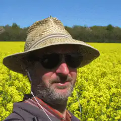 Man in field with laser eyes