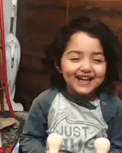 Toddler laughing and falling over