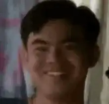 Man smiling then surprised
