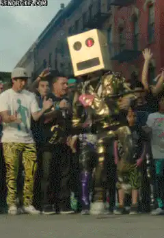 gold robot dancing in street