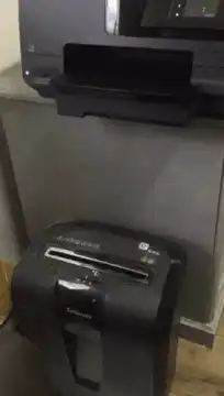 Printer feeds paper into shredder