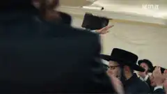 Jewish man dancing on chair