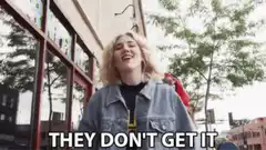 Two women laughing on the street