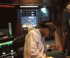 Man in recording studio laughing