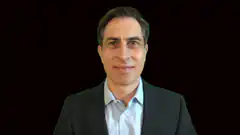 Man in suit nodding slightly
