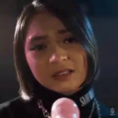 Woman crying into microphone