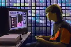 Man playing Tetris and celebrating