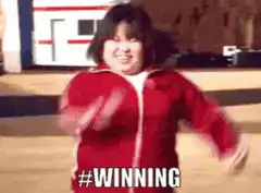 Woman in red tracksuit jumps over bar and falls